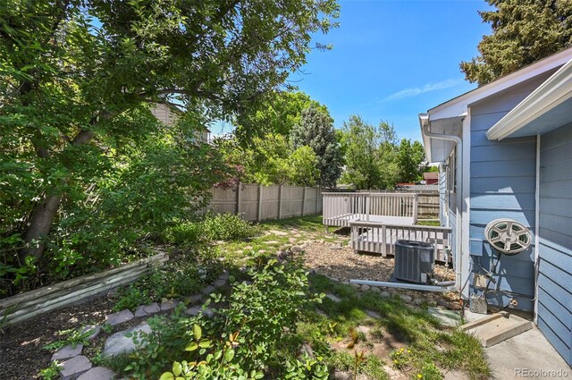 8679 Apache Plume Dr, Parker, CO 80134 - view of yard with cooling unit and a deck