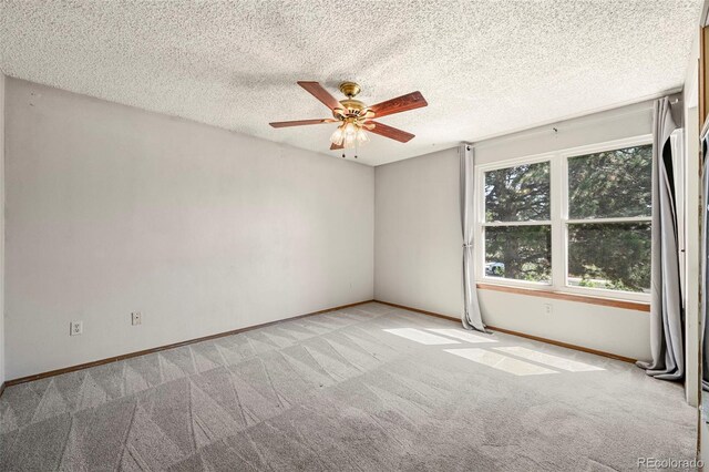 8679 Apache Plume Dr, Parker, CO 80134 - empty room with carpet flooring, a ceiling fan, baseboards, and a textured ceiling