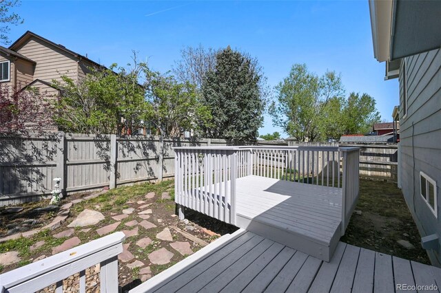 8679 Apache Plume Dr, Parker, CO 80134 - wooden terrace with a fenced backyard