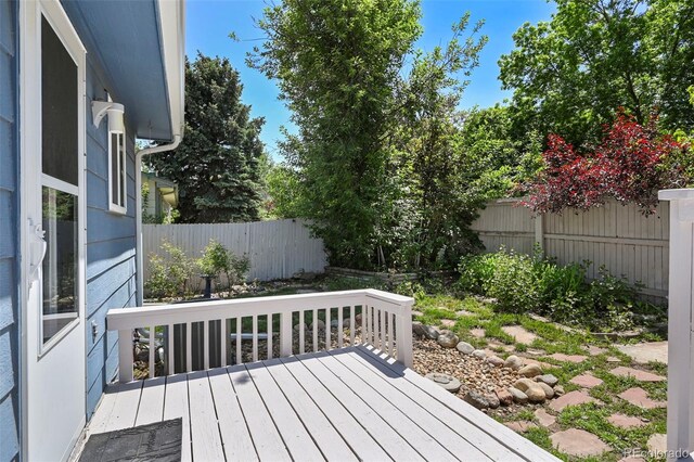 8679 Apache Plume Dr, Parker, CO 80134 - wooden deck featuring a fenced backyard