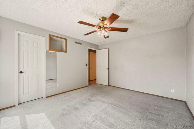 8679 Apache Plume Dr, Parker, CO 80134 - unfurnished bedroom featuring carpet floors, baseboards, a textured ceiling, and a ceiling fan
