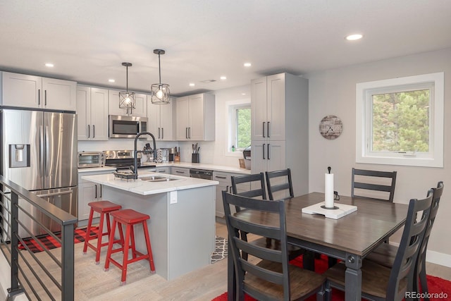 675 Gcr 462, Grand Lake, CO 80447 - kitchen featuring stainless steel appliances, light countertops, light wood-style floors, recessed lighting, and a center island with sink