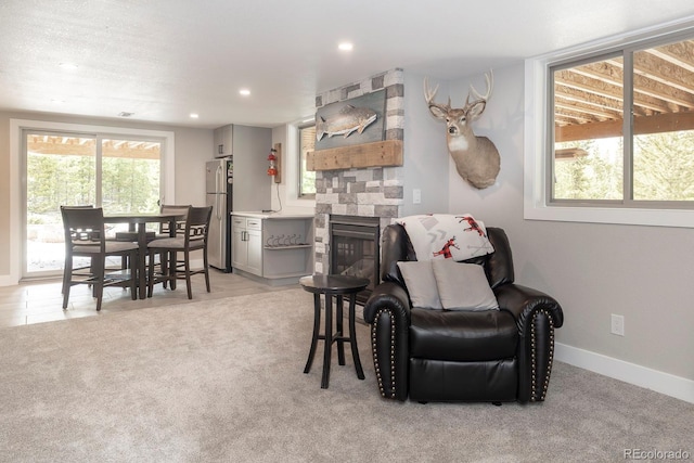 675 Gcr 462, Grand Lake, CO 80447 - dining area featuring a stone fireplace, recessed lighting, baseboards, and light carpet