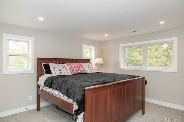 675 Gcr 462, Grand Lake, CO 80447 - bedroom featuring light colored carpet, multiple windows, baseboards, and recessed lighting