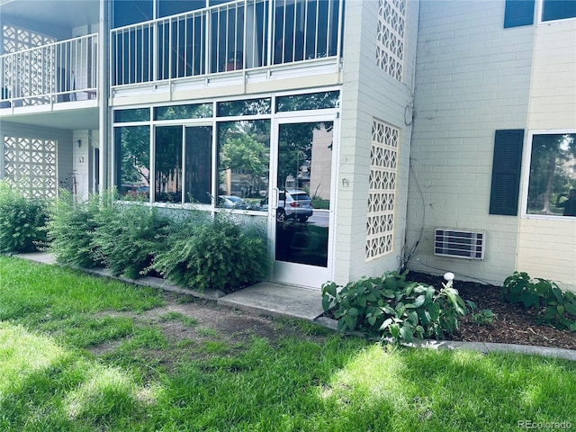 entrance to property featuring a balcony