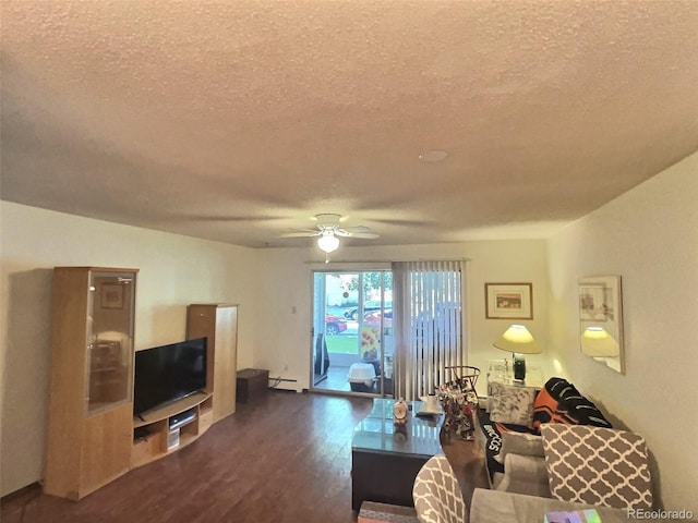 living room with ceiling fan, a textured ceiling, a baseboard heating unit, and dark wood-type flooring