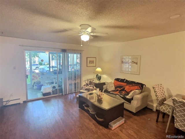 living room featuring plenty of natural light, dark hardwood / wood-style floors, and ceiling fan