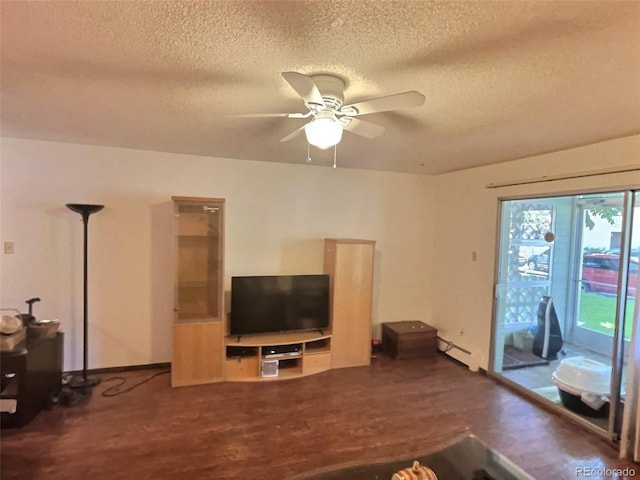 unfurnished living room featuring dark hardwood / wood-style flooring, ceiling fan, a textured ceiling, and a baseboard heating unit