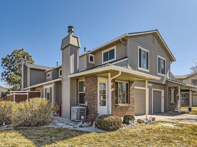 view of front of house featuring driveway, central AC unit, an attached garage, a front lawn, and brick siding