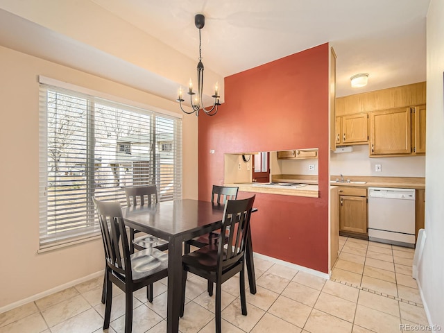 dining area with light tile patterned floors, baseboards, and a chandelier