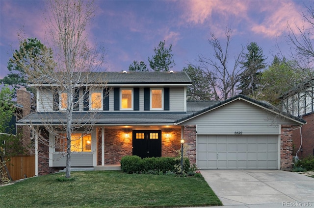 8132 Lodgepole Trl, Lone Tree, CO 80124 - traditional-style house with a front lawn, brick siding, concrete driveway, an attached garage, and a tile roof