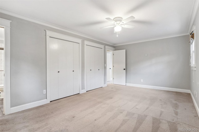 8132 Lodgepole Trl, Lone Tree, CO 80124 - unfurnished bedroom with two closets, baseboards, ornamental molding, and carpet