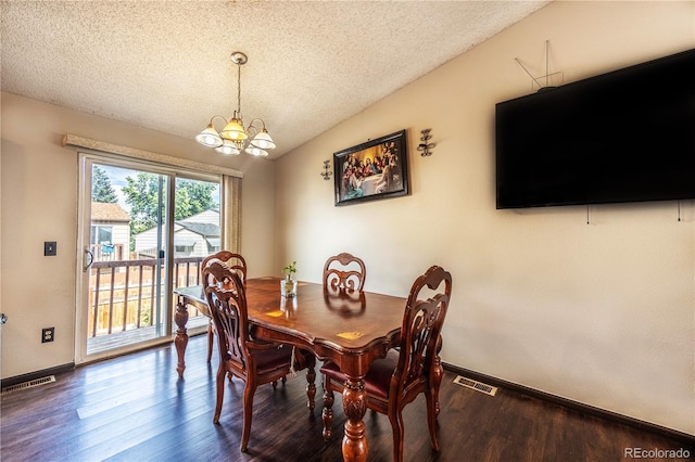 4362 Nepal St, Denver, CO 80249 - dining room with a textured ceiling, a chandelier, wood finished floors, and lofted ceiling