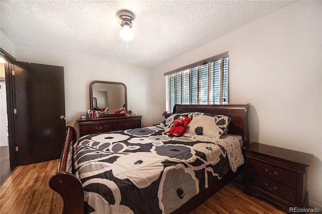 4362 Nepal St, Denver, CO 80249 - bedroom with wood finished floors and a textured ceiling