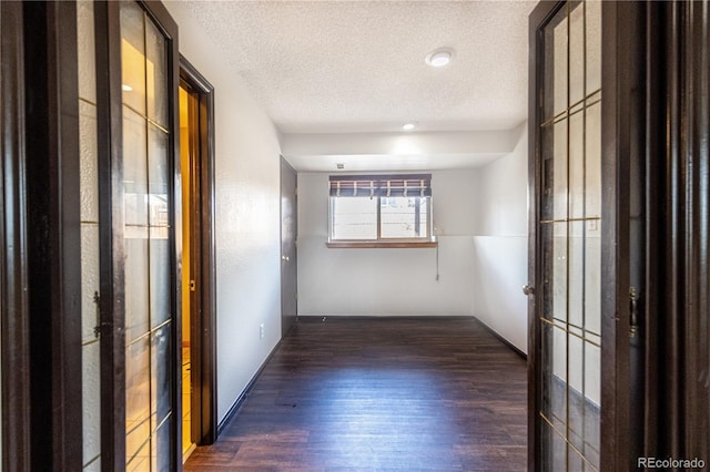 4362 Nepal St, Denver, CO 80249 - unfurnished room featuring wood finished floors and a textured ceiling