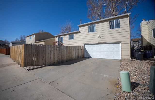 4362 Nepal St, Denver, CO 80249 - back of property featuring an attached garage and driveway