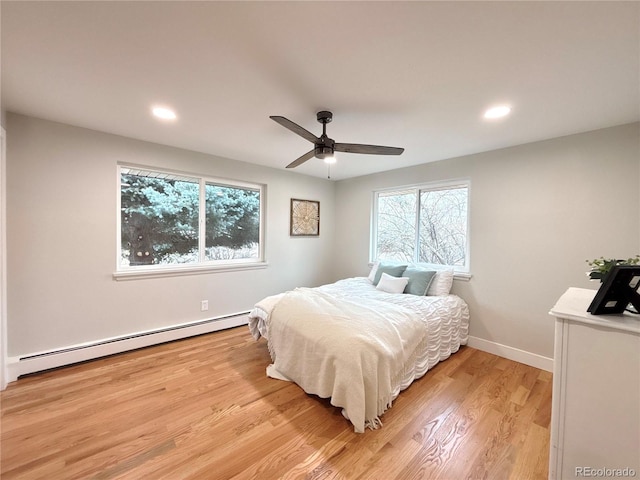 bedroom featuring baseboards, ceiling fan, a baseboard radiator, light wood-style flooring, and recessed lighting