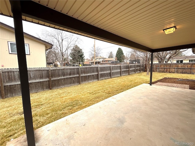 view of yard featuring a patio area and a fenced backyard