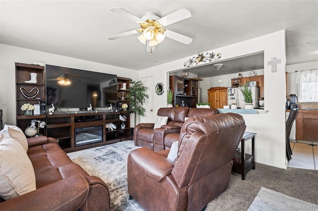 12167 E Exposition Ave, Aurora, CO 80012 - living area with a ceiling fan and carpet