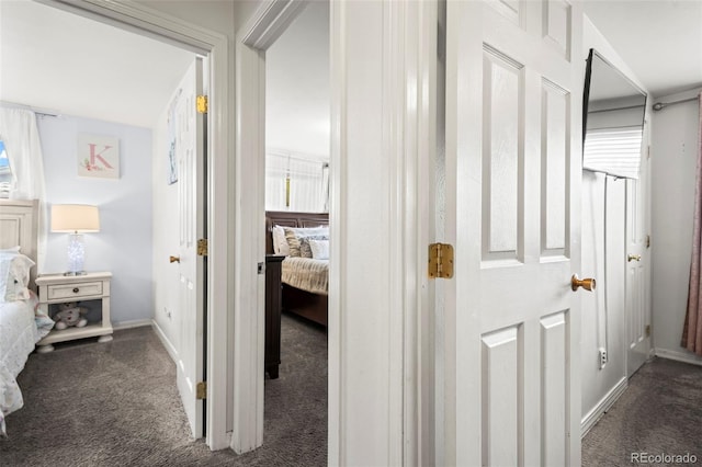 12167 E Exposition Ave, Aurora, CO 80012 - corridor featuring carpet floors and baseboards