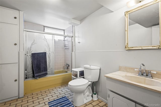 12167 E Exposition Ave, Aurora, CO 80012 - full bathroom featuring vanity, toilet, and bath / shower combo with glass door