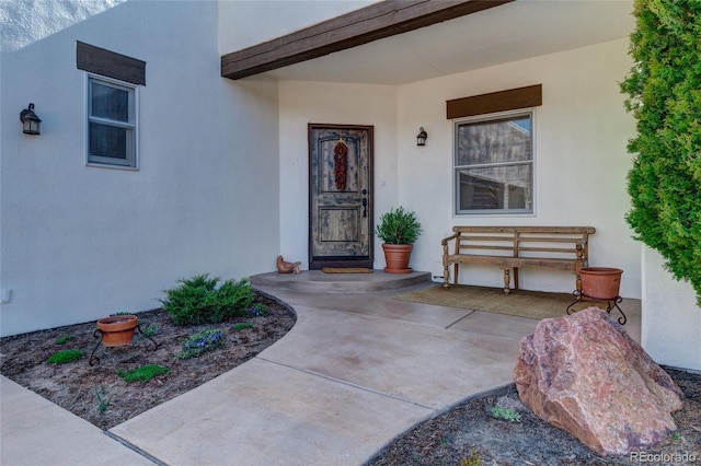 property entrance featuring a patio