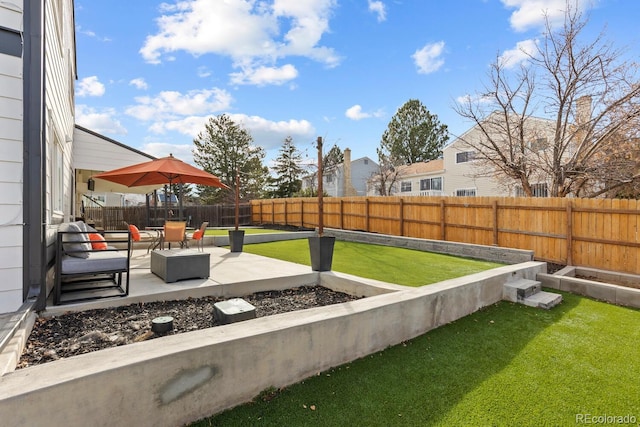 view of yard with a patio area and a fenced backyard