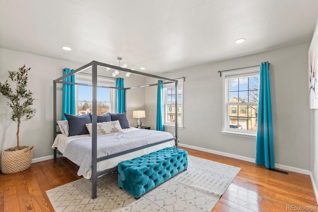 bedroom featuring recessed lighting, visible vents, baseboards, and light wood-style floors