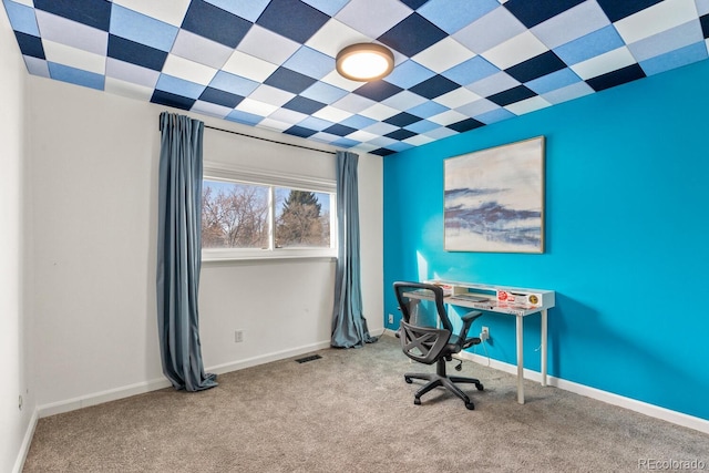 carpeted home office with baseboards and visible vents