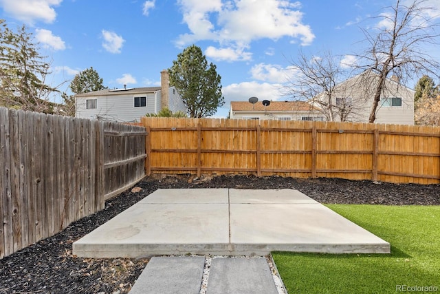 view of yard featuring a patio and a fenced backyard