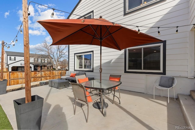 view of patio / terrace with outdoor dining area and fence