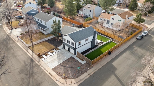 birds eye view of property with a residential view