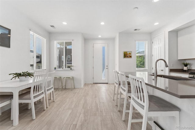 dining room with visible vents, a healthy amount of sunlight, and recessed lighting