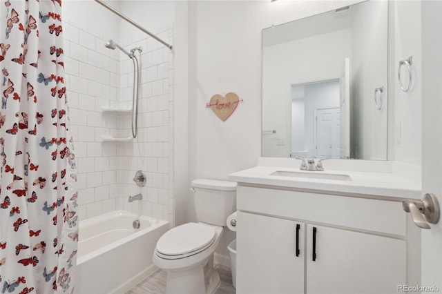 bathroom with toilet, shower / tub combo with curtain, and vanity