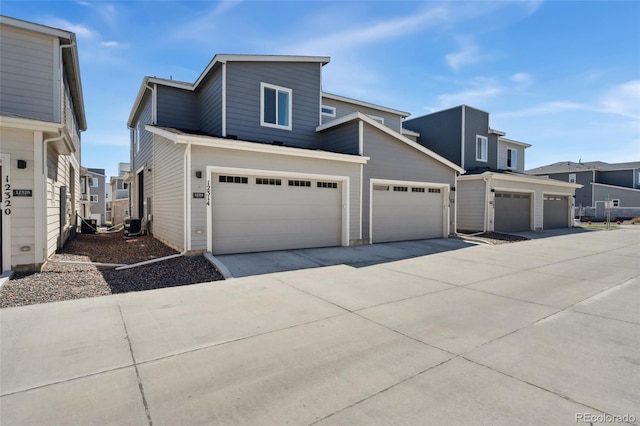 townhome / multi-family property with driveway and a residential view
