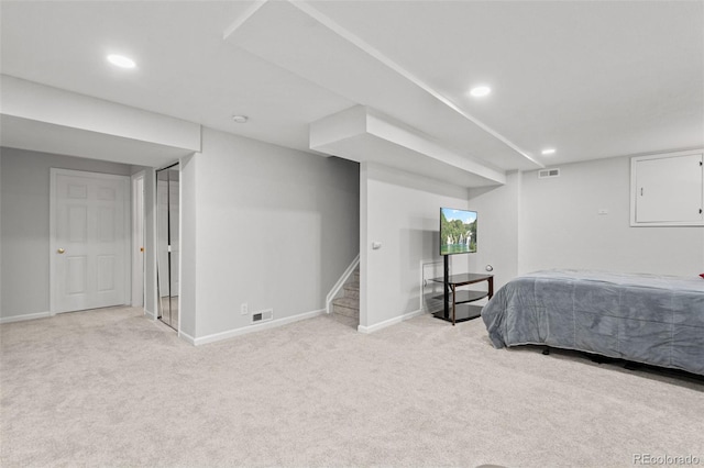 bedroom with light colored carpet