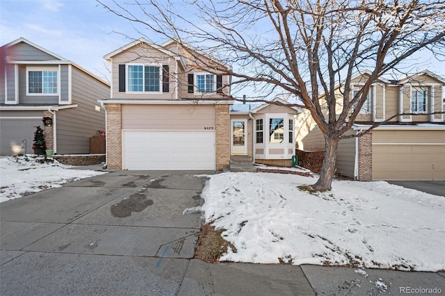 view of front of home featuring a garage and central AC unit