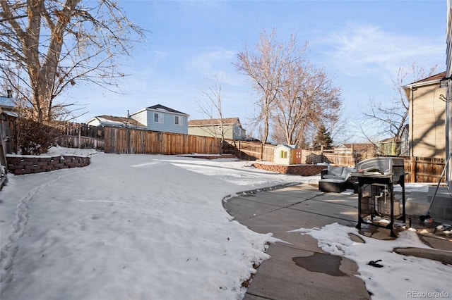 view of yard layered in snow