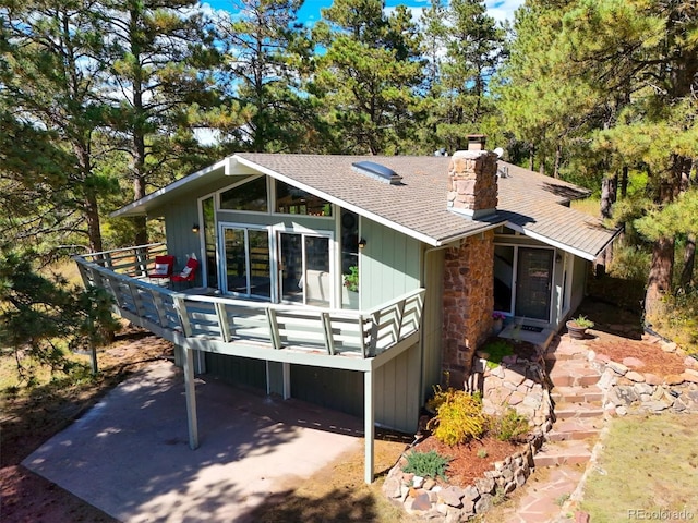 view of front of property with a wooden deck