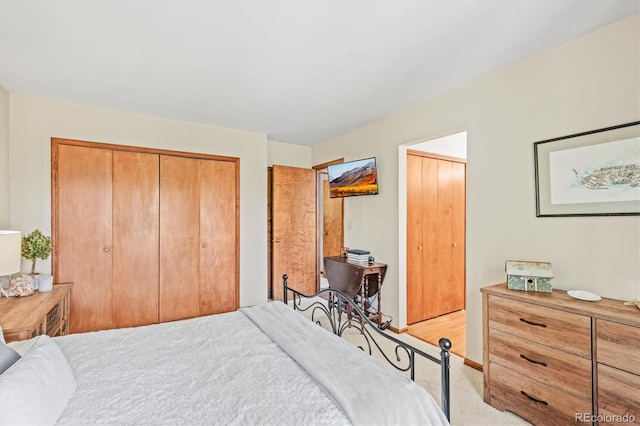 bedroom featuring light carpet