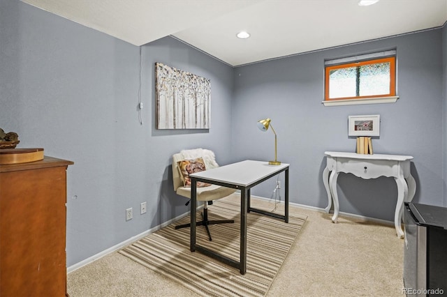 office area featuring light colored carpet