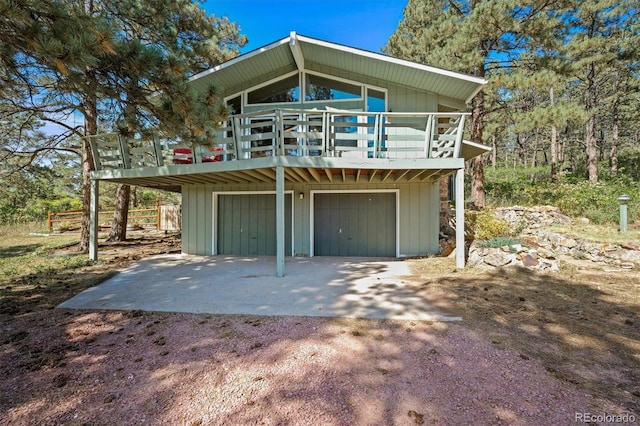 exterior space featuring a garage and a deck