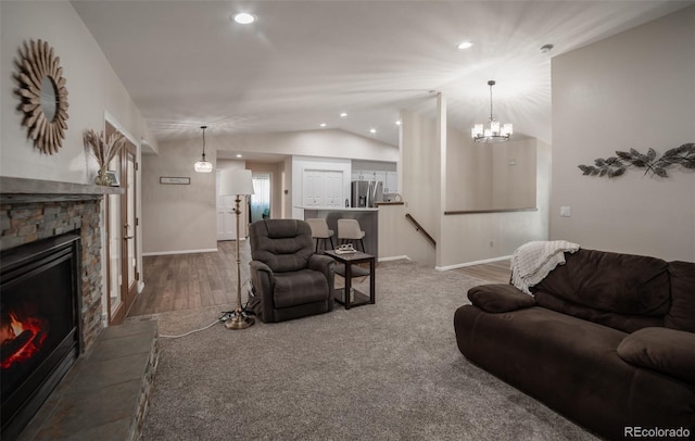 11030 Pine Meadows Rd, Colorado Springs, CO 80908 - living room featuring lofted ceiling, a fireplace, wood finished floors, recessed lighting, and a chandelier