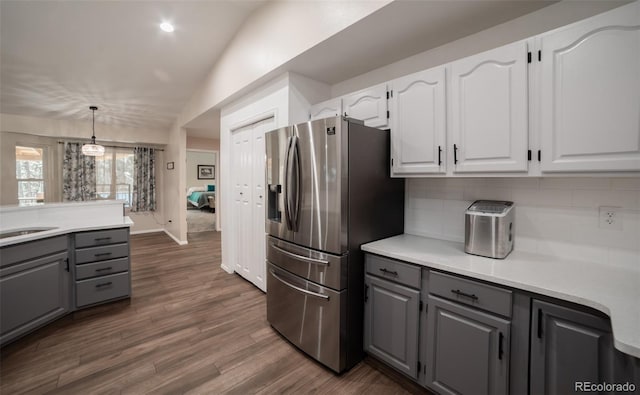 11030 Pine Meadows Rd, Colorado Springs, CO 80908 - kitchen with stainless steel fridge with ice dispenser, gray cabinetry, tasteful backsplash, white cabinets, and lofted ceiling
