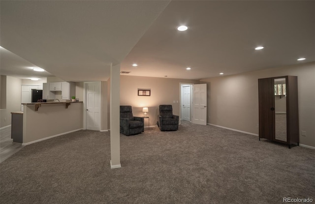 11030 Pine Meadows Rd, Colorado Springs, CO 80908 - finished basement featuring refrigerator, dark colored carpet, and recessed lighting