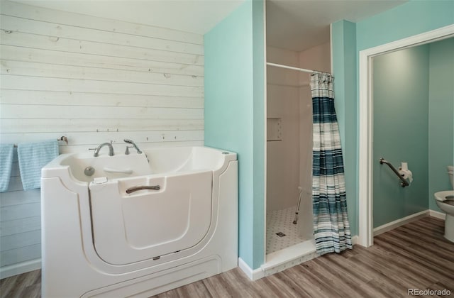 11030 Pine Meadows Rd, Colorado Springs, CO 80908 - full bath featuring a stall shower and wood finished floors