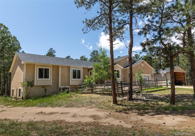 11030 Pine Meadows Rd, Colorado Springs, CO 80908 - single story home featuring an attached garage and stucco siding