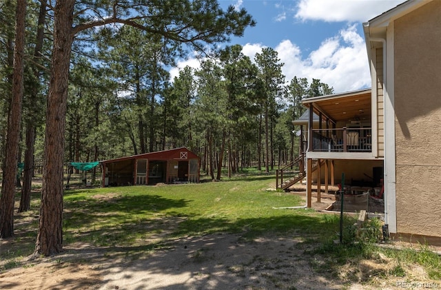 11030 Pine Meadows Rd, Colorado Springs, CO 80908 - view of grassy yard featuring stairway and an outbuilding