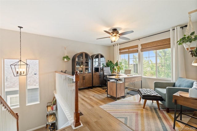 7853 S Jasper Way, Englewood, CO 80112 - office area with light wood finished floors, a chandelier, and ceiling fan