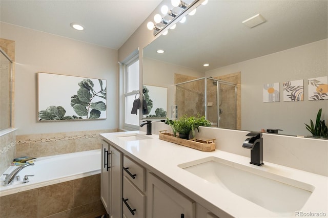 7853 S Jasper Way, Englewood, CO 80112 - full bathroom featuring double vanity, a garden tub, a shower stall, and recessed lighting
